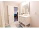 Bathroom featuring a modern vanity and a doorway view into adjacent room with seating at 2575 Baker Nw Rd, Atlanta, GA 30318