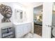 Bright bathroom with stylish vanity, contemporary decor, and doorway view into adjacent bedroom at 2575 Baker Nw Rd, Atlanta, GA 30318