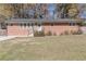 Ranch style brick home with landscaped lawn at 2575 Baker Nw Rd, Atlanta, GA 30318