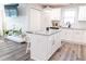 Modern kitchen with white shaker cabinets and granite island at 2575 Baker Nw Rd, Atlanta, GA 30318