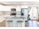 White kitchen with granite island and stainless steel appliances at 2575 Baker Nw Rd, Atlanta, GA 30318