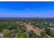 Aerial view of a green landscape with cityscape in the distance at 311 Deering Nw Rd, Atlanta, GA 30309