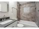 Clean bathroom with tub, shower, and grey tile at 311 Deering Nw Rd, Atlanta, GA 30309