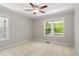 Bright bedroom with window, ceiling fan, and carpet at 311 Deering Nw Rd, Atlanta, GA 30309