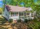 Side view of a charming white ranch home with a covered porch at 311 Deering Nw Rd, Atlanta, GA 30309