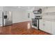 Modern kitchen with stainless steel appliances and white cabinets at 311 Deering Nw Rd, Atlanta, GA 30309