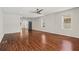 Hardwood floor living room with ceiling fan and view to kitchen at 311 Deering Nw Rd, Atlanta, GA 30309