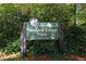 Sign for Tanyard Creek Park, indicating park hours at 311 Deering Nw Rd, Atlanta, GA 30309