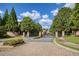 Gated community entrance with brick columns and landscaping at 10444 Park Walk Pt, Alpharetta, GA 30022