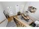 Bright dining room with hardwood floors and a view from the upstairs at 10444 Park Walk Pt, Alpharetta, GA 30022