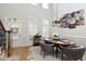 Bright dining room with hardwood floors and a modern chandelier at 10444 Park Walk Pt, Alpharetta, GA 30022