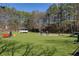 Dog park with artificial turf, benches, and shaded areas for pet owners at 10444 Park Walk Pt, Alpharetta, GA 30022