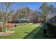 Dog park with artificial turf, benches, and shaded areas for pet owners at 10444 Park Walk Pt, Alpharetta, GA 30022