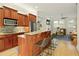 Kitchen boasts wood cabinets, granite island, and stainless steel appliances at 10444 Park Walk Pt, Alpharetta, GA 30022