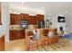 Kitchen boasts wood cabinets, granite island, and stainless steel appliances at 10444 Park Walk Pt, Alpharetta, GA 30022