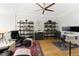 Home office with hardwood floors, ceiling fan, and built in shelving at 10444 Park Walk Pt, Alpharetta, GA 30022