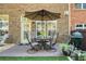 Patio with seating for four and a green egg grill at 10444 Park Walk Pt, Alpharetta, GA 30022