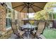 Relaxing patio with seating area, umbrella, and artificial turf at 10444 Park Walk Pt, Alpharetta, GA 30022