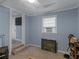 Cozy basement room featuring a fireplace and ample storage at 1202 Coan Dr, Locust Grove, GA 30248