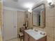 Well-lit bathroom featuring a vanity with sink and large mirror at 1202 Coan Dr, Locust Grove, GA 30248