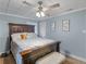 Charming bedroom with a wooden bed frame and calming decor at 1202 Coan Dr, Locust Grove, GA 30248