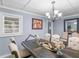 Formal dining room, featuring a chandelier and large table at 1202 Coan Dr, Locust Grove, GA 30248