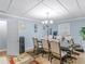 Bright dining room with a wooden table and chandelier at 1202 Coan Dr, Locust Grove, GA 30248