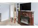 Living room with fireplace and mounted TV at 1202 Coan Dr, Locust Grove, GA 30248