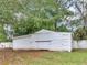 White storage shed in the backyard at 1202 Coan Dr, Locust Grove, GA 30248