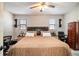 Bedroom with neutral walls, carpet, and a traditional-style bed, wardrobe, and workspace at 4288 Post Rd, Winston, GA 30187