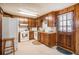 Classic kitchen featuring wooden cabinets, white appliances, and a cozy nook, showing practical design at 4288 Post Rd, Winston, GA 30187