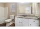 Bathroom with granite countertop and white cabinets at 459 Pleasant Way, Temple, GA 30179