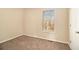 Simple bedroom with neutral walls and carpet at 459 Pleasant Way, Temple, GA 30179