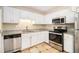 Kitchen with stainless steel appliances and granite countertops at 459 Pleasant Way, Temple, GA 30179