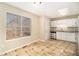 Kitchen with white cabinets, granite counters, and tile floor at 459 Pleasant Way, Temple, GA 30179