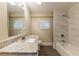 Renovated bathroom featuring a bathtub, granite countertop, and updated fixtures at 2504 Stone Rd, Atlanta, GA 30344