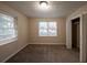 Bright bedroom featuring two windows and a walk-in closet at 2504 Stone Rd, Atlanta, GA 30344