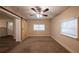 Versatile bonus room with barn door entry, window, and ceiling fan at 2504 Stone Rd, Atlanta, GA 30344