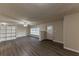 Open living room with built-in shelving and hardwood floors at 2504 Stone Rd, Atlanta, GA 30344