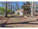 Ranch home with attached garage and a gravel driveway at 364 Stafford Sw St, Marietta, GA 30064