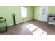 Light green spare bedroom with new flooring and lots of natural light at 364 Stafford Sw St, Marietta, GA 30064