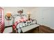 Primary bedroom with red and white gingham bedding and farmhouse decor at 405 Laurel Spring Ct, Canton, GA 30114