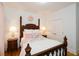 Charming bedroom with a four-poster bed and hardwood floors at 405 Laurel Spring Ct, Canton, GA 30114