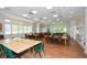 Large community room with tables and chairs at 405 Laurel Spring Ct, Canton, GA 30114