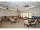 Spacious community room with tables, chairs, and ceiling fans at 405 Laurel Spring Ct, Canton, GA 30114