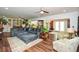 Spacious living room featuring a large sectional sofa and hardwood floors at 405 Laurel Spring Ct, Canton, GA 30114