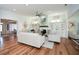 Open concept living room with a fireplace and built-in shelving at 405 Laurel Spring Ct, Canton, GA 30114