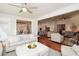 Open living room with hardwood floors and views into kitchen and dining areas at 405 Laurel Spring Ct, Canton, GA 30114