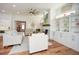 Bright living room features hardwood floors, comfy sofas, and built-in shelving at 405 Laurel Spring Ct, Canton, GA 30114