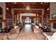 Elegant community clubhouse lobby with comfortable seating and a grand fireplace at 405 Laurel Spring Ct, Canton, GA 30114